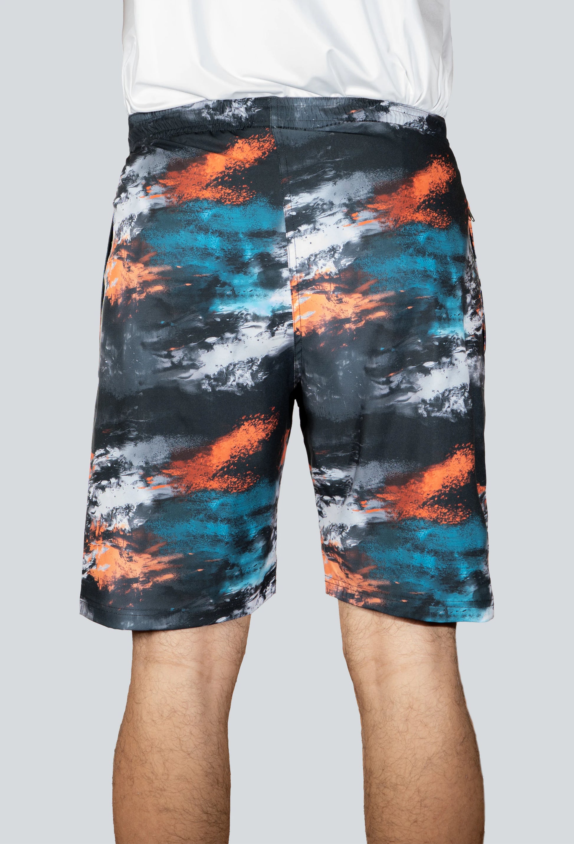 Pantaloneta licrada cierre bolsillos cammo mancha azul naranja negro