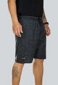 Pantaloneta licrada cierre bolsillos jaguar print gris